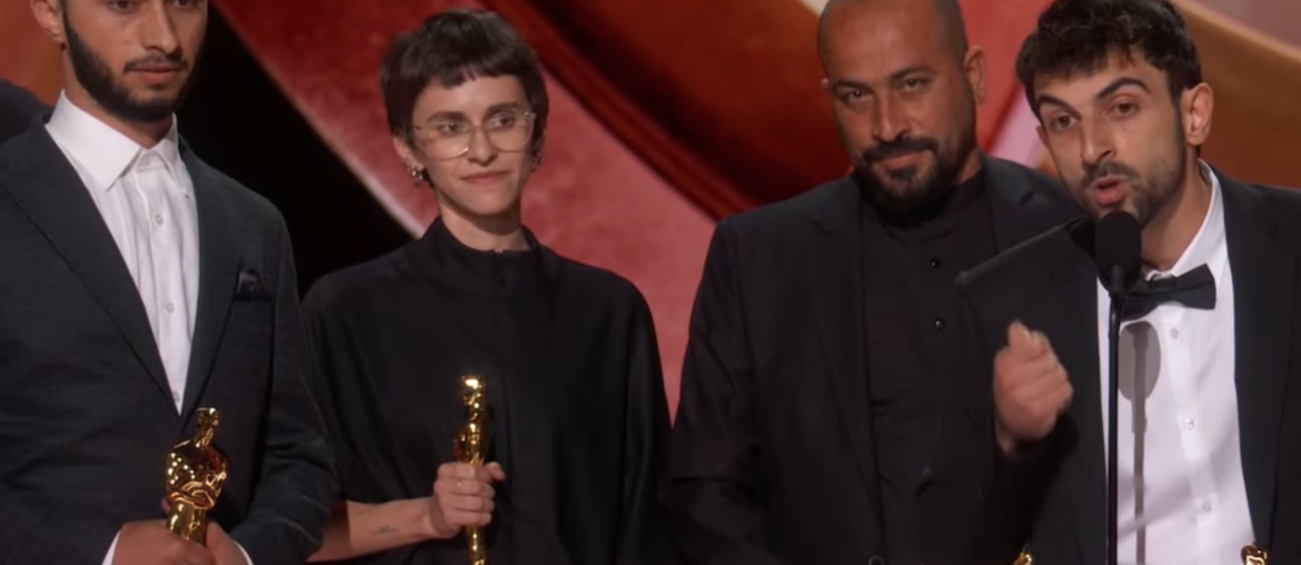 Yuval Abraham gives his acceptance speech after winning the Documentary Feature Film award for "No Other Land" during the 97th Annual Oscars as Basel Adra looks on, on March 2, 2025. (Image: Screenshot)